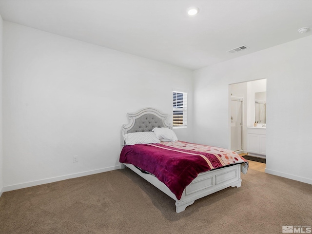 bedroom featuring light colored carpet, baseboards, and visible vents