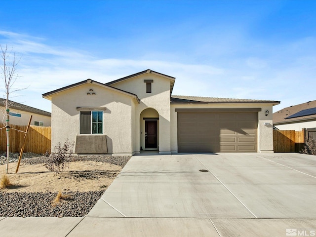 ranch-style home featuring a garage, concrete driveway, fence, and stucco siding