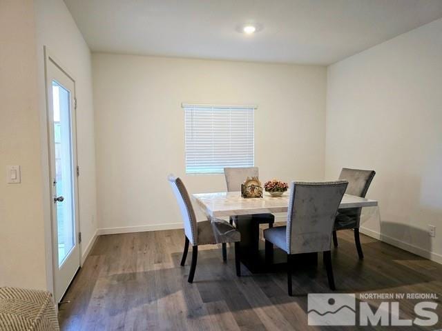 dining space with hardwood / wood-style floors and a wealth of natural light