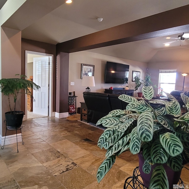 living room with vaulted ceiling with beams