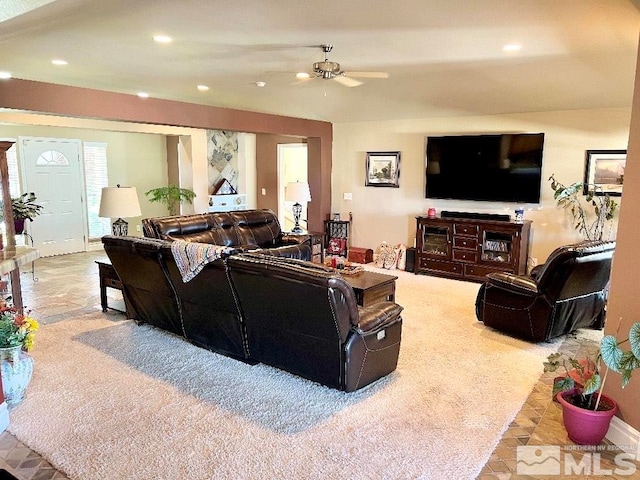 living room with light colored carpet and ceiling fan