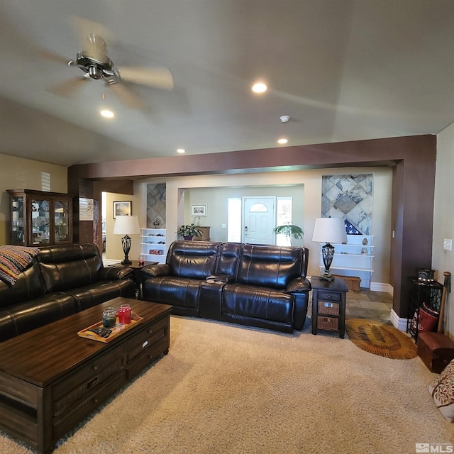 living room with ceiling fan and carpet