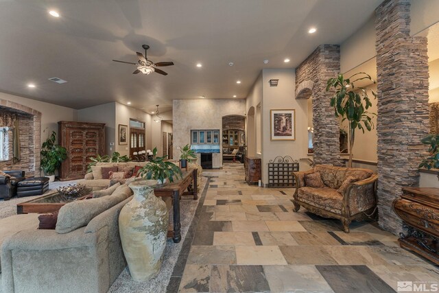 living room featuring ceiling fan