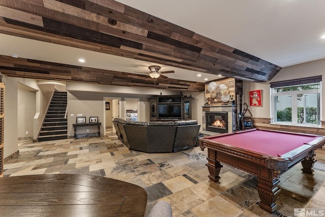 rec room featuring ceiling fan, a stone fireplace, and pool table