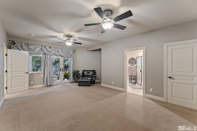 unfurnished room with ceiling fan and light colored carpet