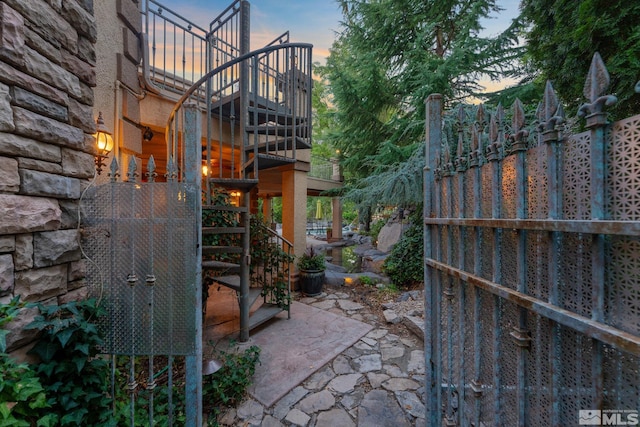 view of patio terrace at dusk