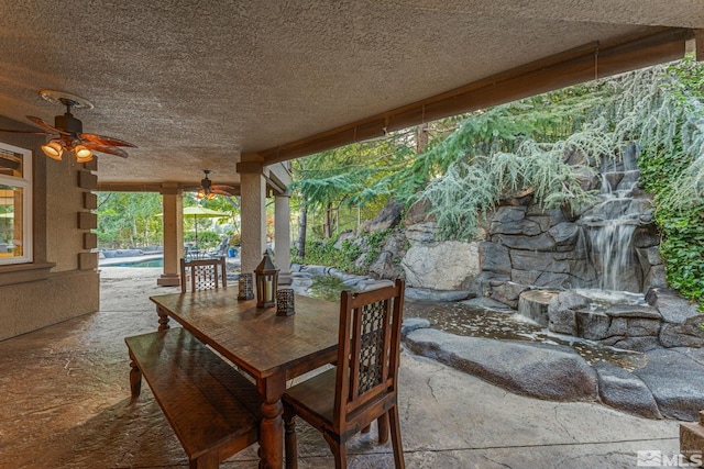 view of patio featuring ceiling fan