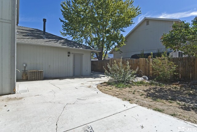 view of side of home with a patio