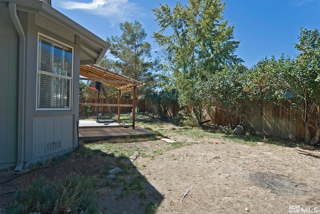 view of yard featuring a wooden deck