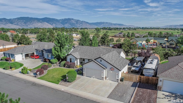 birds eye view of property with a mountain view