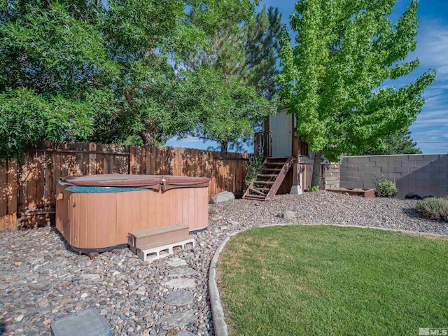 view of yard with a hot tub