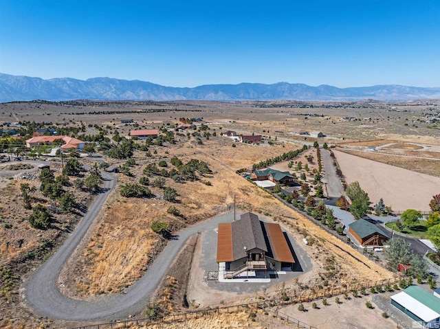 birds eye view of property with a mountain view