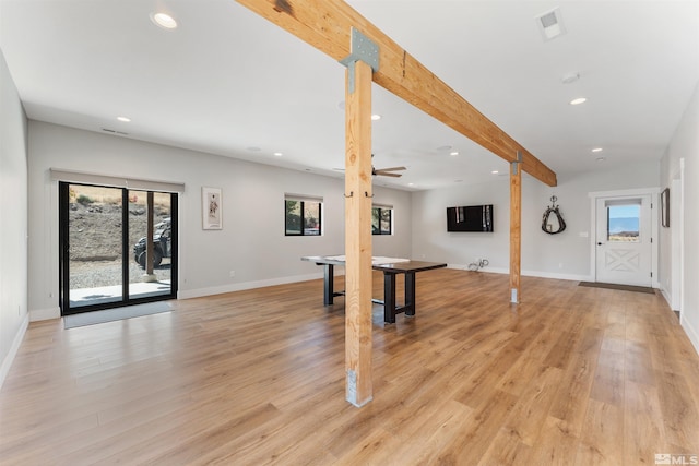 interior space featuring light wood-type flooring, recessed lighting, and a healthy amount of sunlight