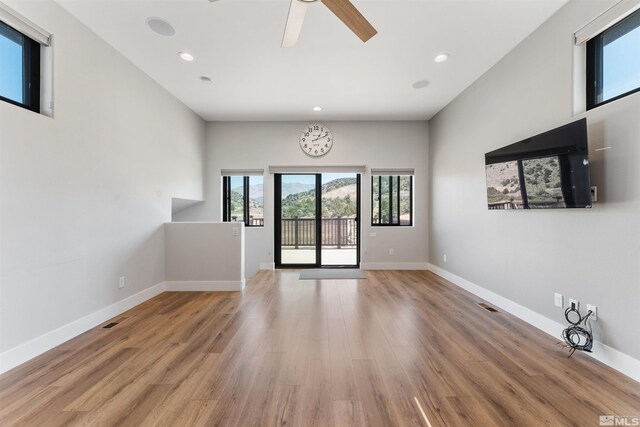 interior space with recessed lighting, baseboards, light wood-style floors, visible vents, and a ceiling fan