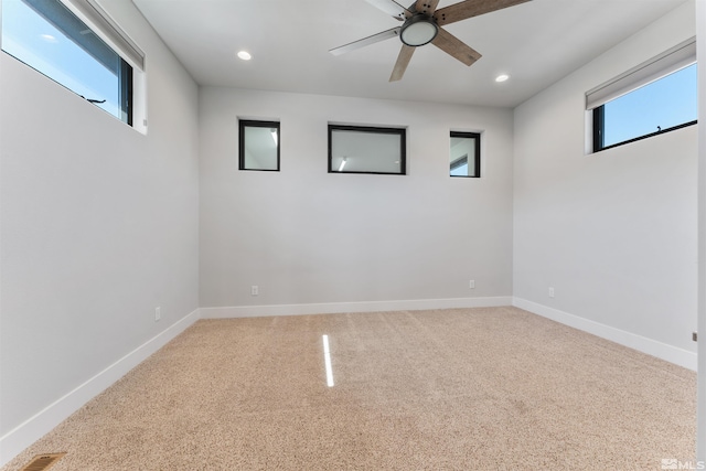 empty room with recessed lighting, carpet floors, baseboards, and ceiling fan