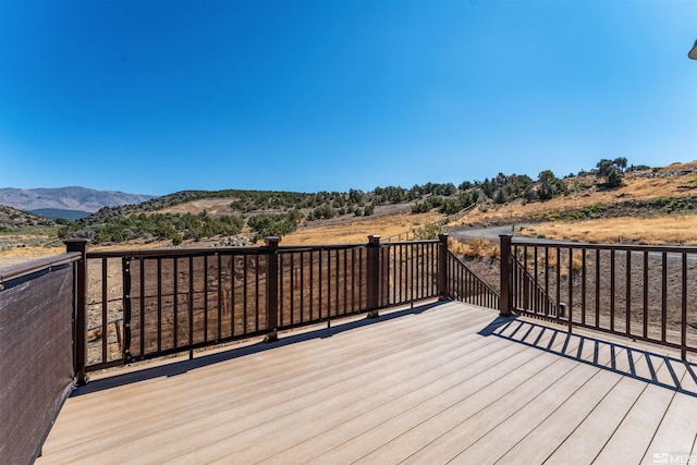 wooden terrace featuring a mountain view