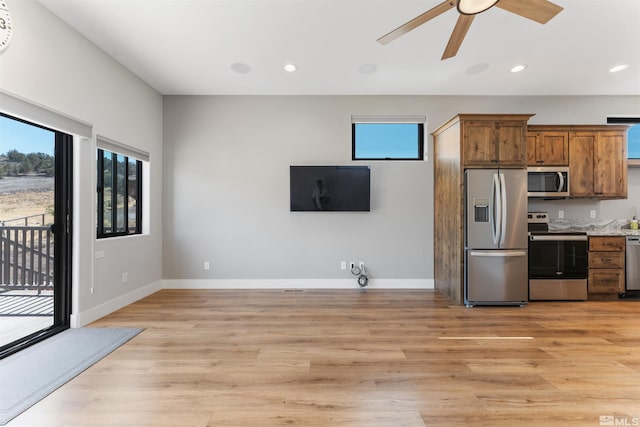 kitchen with recessed lighting, stainless steel appliances, light wood-style floors, and a ceiling fan