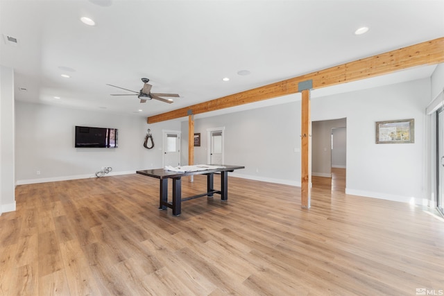 playroom with beam ceiling, light wood finished floors, and recessed lighting