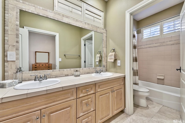 full bathroom featuring vanity, toilet, and shower / bathtub combination with curtain