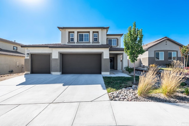 prairie-style house featuring a garage