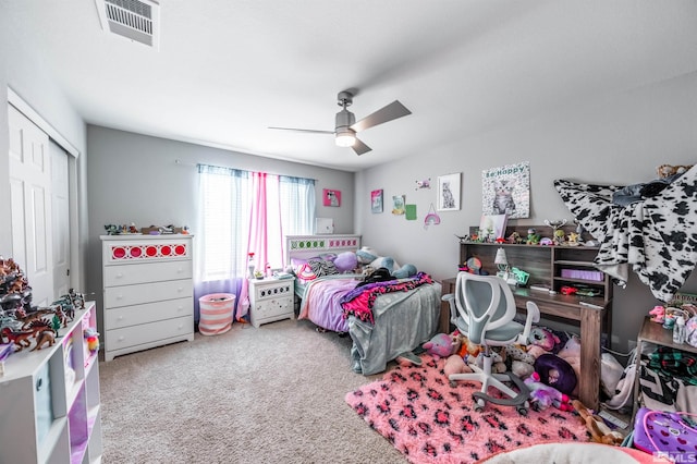 bedroom featuring carpet flooring, ceiling fan, and a closet