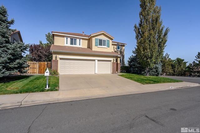 view of front of property with a front lawn and a garage