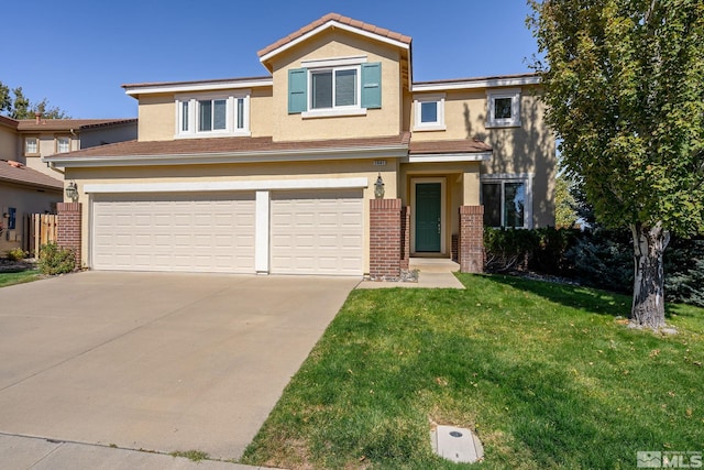 view of front of property featuring a garage and a front lawn