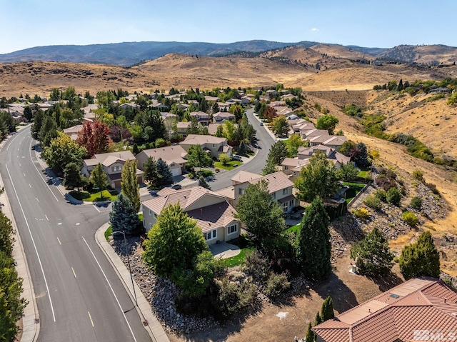 birds eye view of property featuring a mountain view