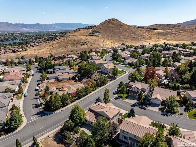 birds eye view of property featuring a mountain view