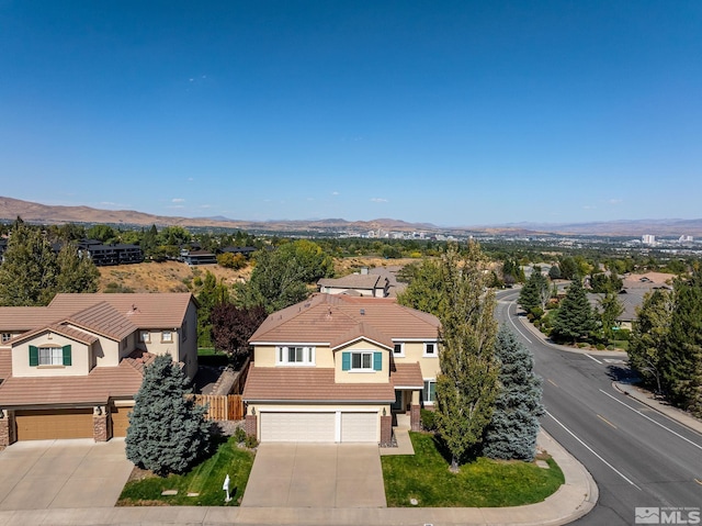 drone / aerial view featuring a mountain view