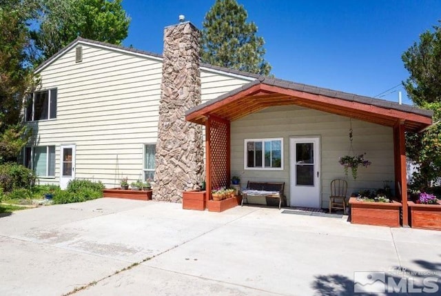 back of property featuring a patio area