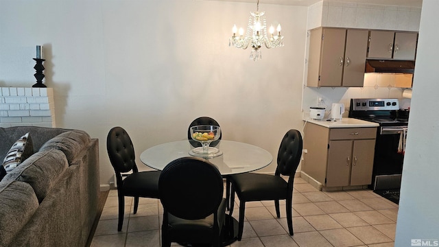 tiled dining space featuring a notable chandelier