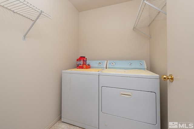 clothes washing area with independent washer and dryer