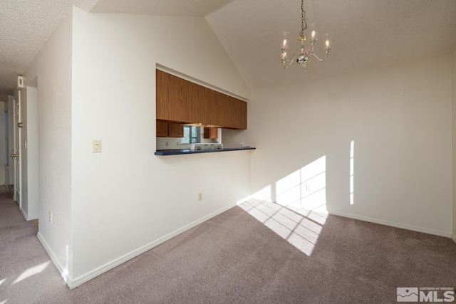 interior space with lofted ceiling, light carpet, and a chandelier