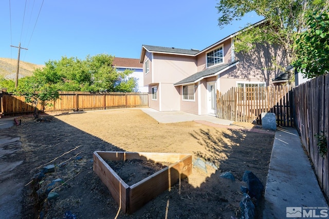 back of property featuring a patio area