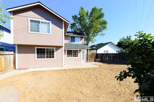 back of house with a patio area