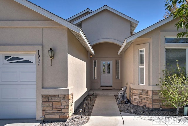 doorway to property featuring a garage