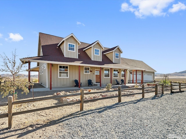 view of front of house featuring a mountain view and covered porch