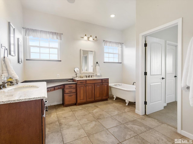 bathroom with a bathtub and vanity