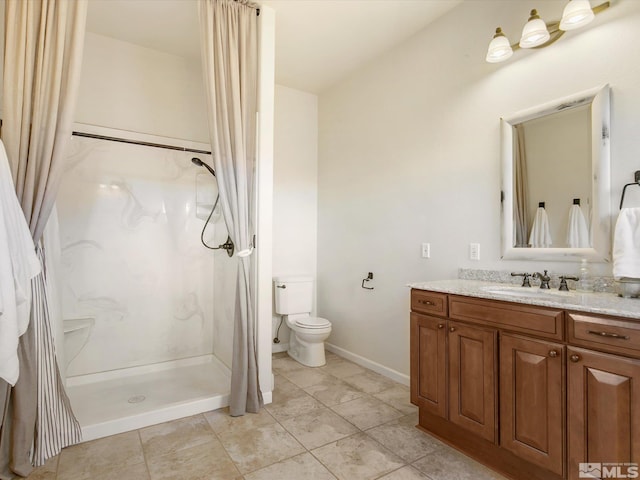 bathroom with walk in shower, vanity, tile patterned flooring, and toilet