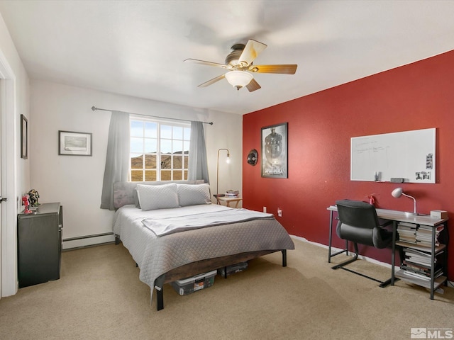 carpeted bedroom featuring ceiling fan and baseboard heating