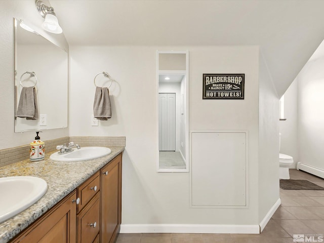 bathroom featuring vanity, toilet, and tile patterned floors