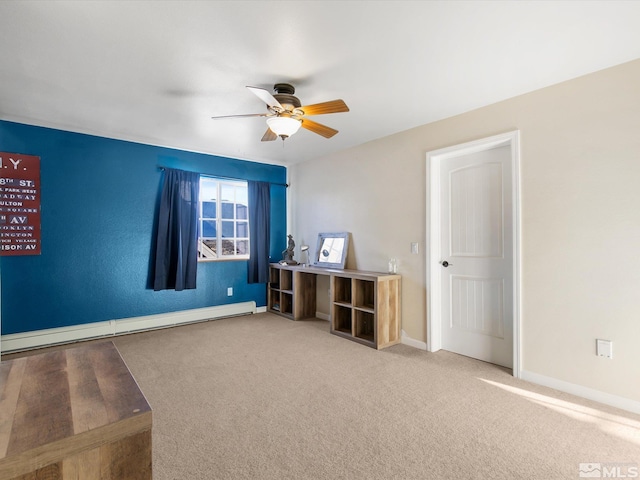 empty room featuring a baseboard heating unit, ceiling fan, and carpet flooring