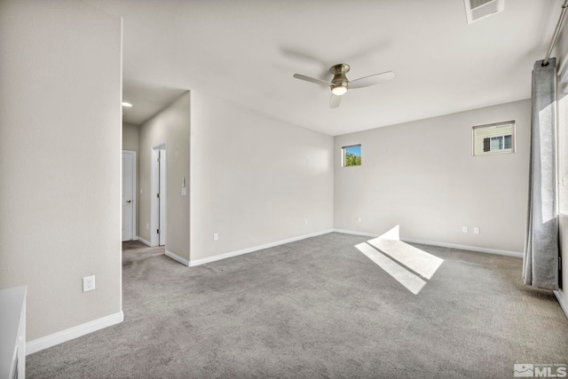 unfurnished room featuring ceiling fan and carpet floors