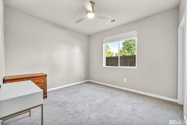 empty room with carpet flooring and ceiling fan