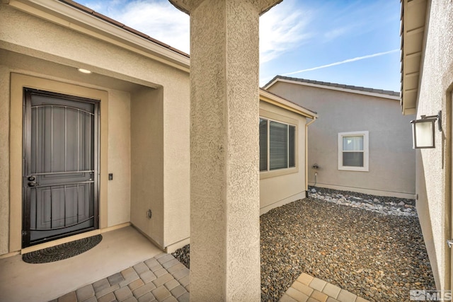 doorway to property with a patio area