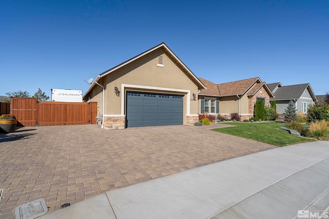 view of front of house with a garage and a front yard