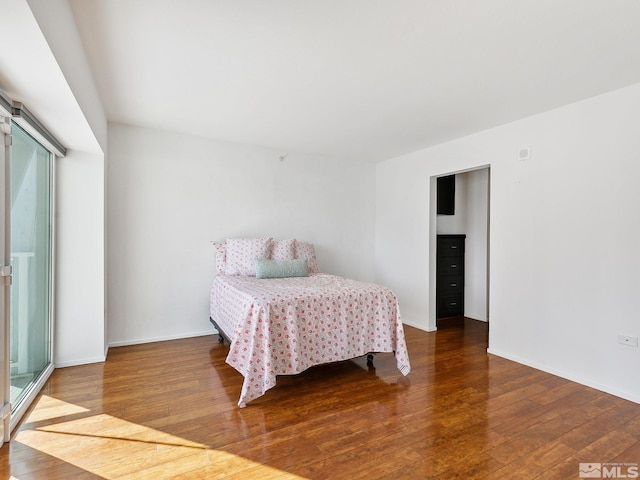 bedroom with wood-type flooring