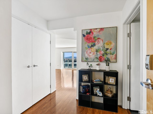 hall with hardwood / wood-style floors