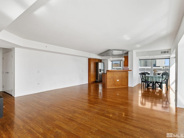 unfurnished living room with hardwood / wood-style floors